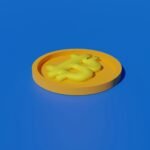 a yellow plastic object sitting on top of a blue surface